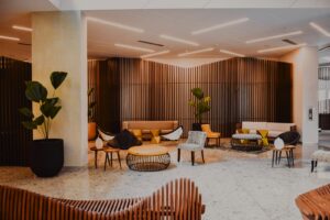modern hotel lobby with designer furniture and wood walls